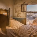Desert Ship - photography of sand inside the house