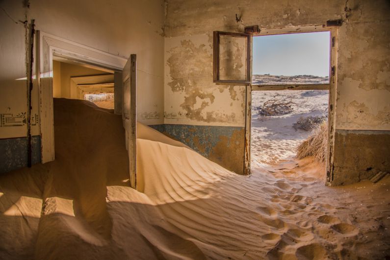 Desert Ship - photography of sand inside the house
