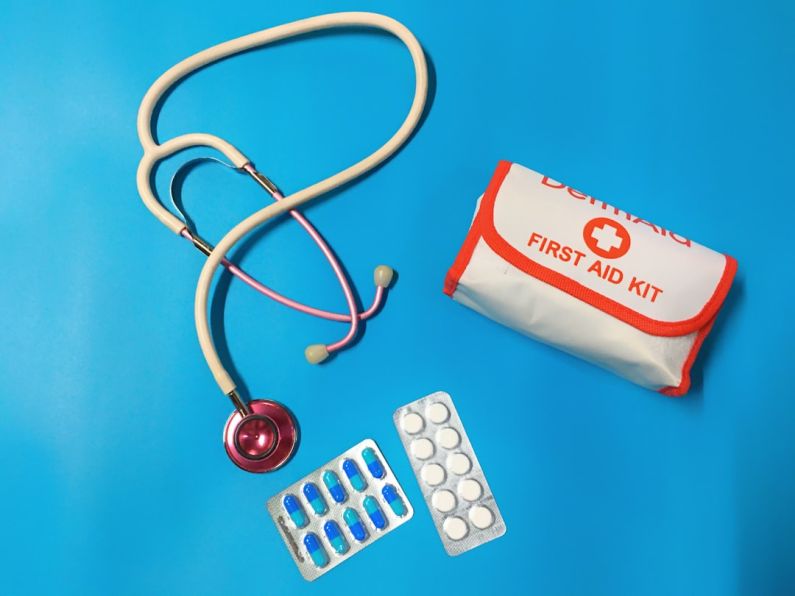 First Aid Kit - a bag of pills, a stethoscope, and a first aid kit
