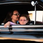 Family Cruise - girl and woman inside black car