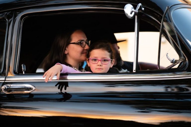 Family Cruise - girl and woman inside black car