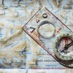 Ancient Compass - clear and white compass with ruler on map illustration